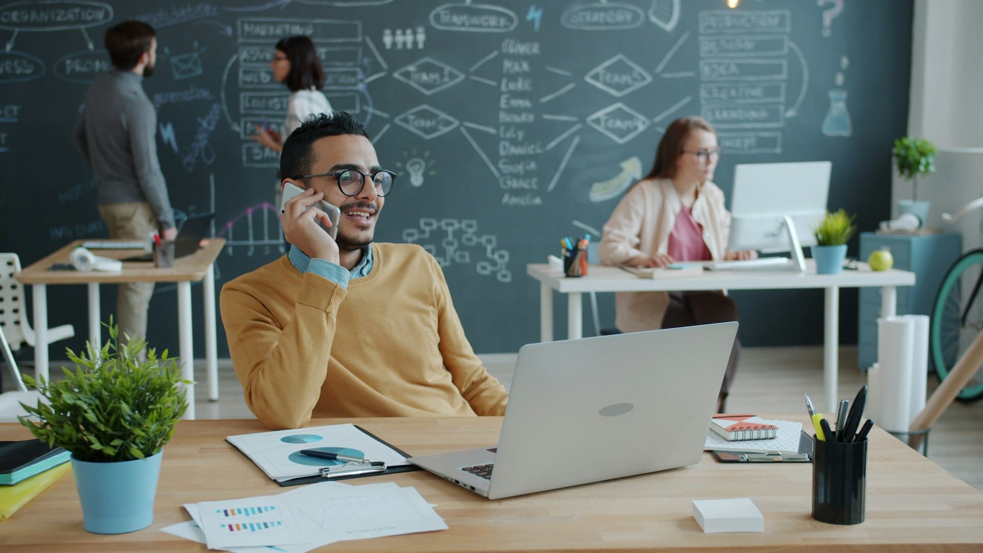 A business owner using a mobile in the field across Cumbria, the kind of user JJM Networks arranges Vodafone and EE business mobile deals for from Carlisle